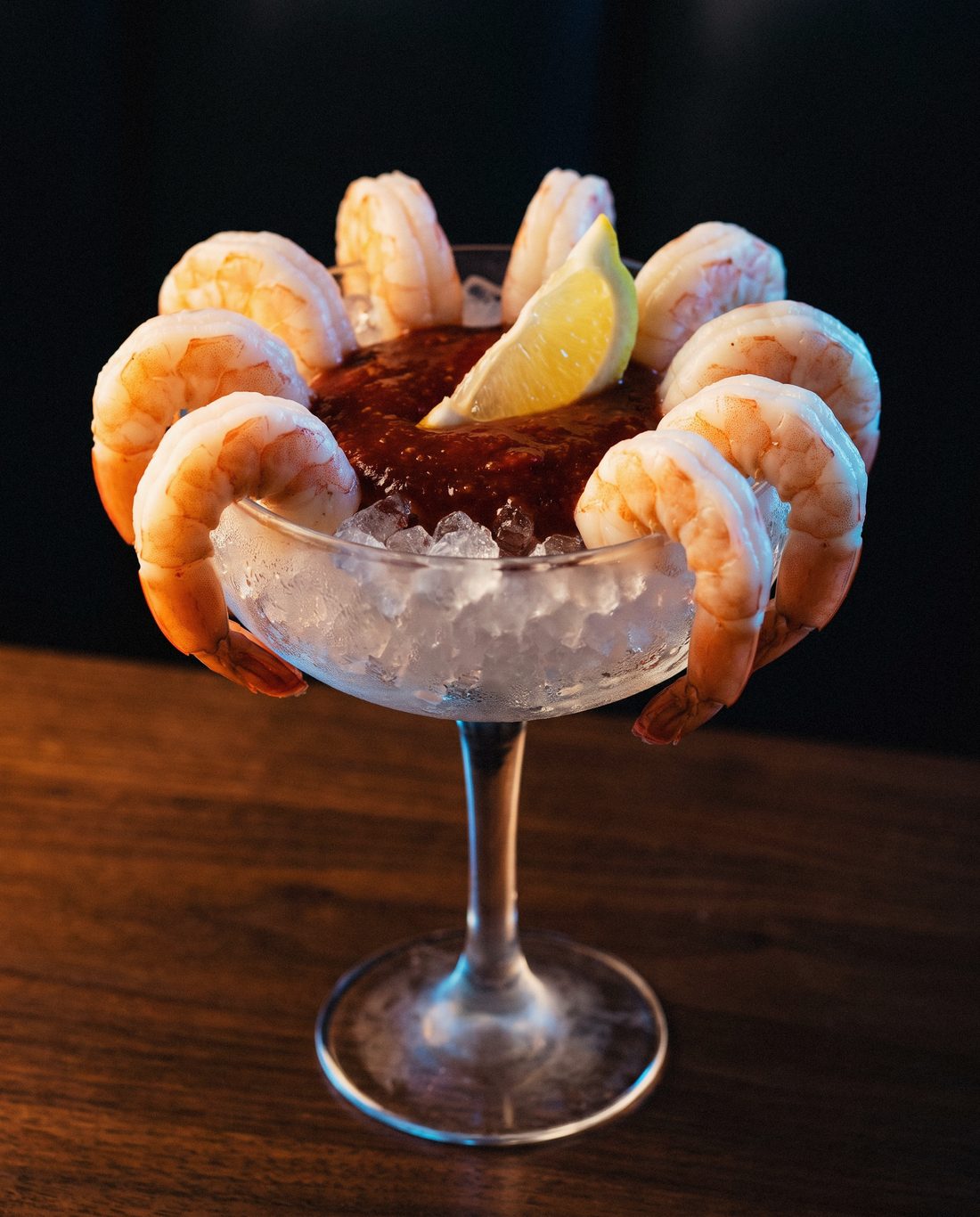 Shrimp cocktail over crushed ice with cocktail sauce